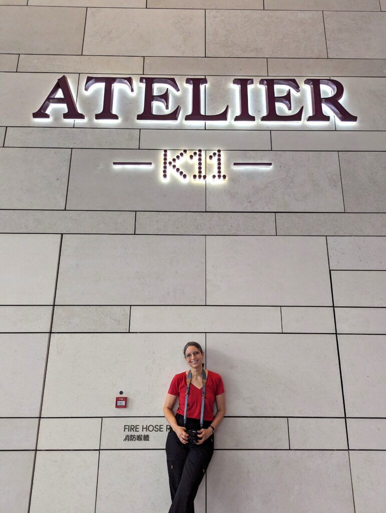 The Lanham Hotel Hong Kong. Photo is showing Angela Acosta, founder of Angela Atelier who had to take a photo under the sign of a hotel with her business namesake.
